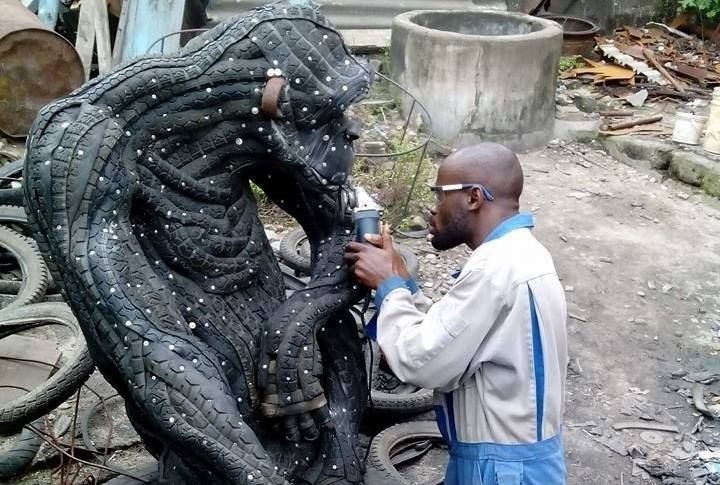 Ernest Nkwocha art work sculpting with tyres